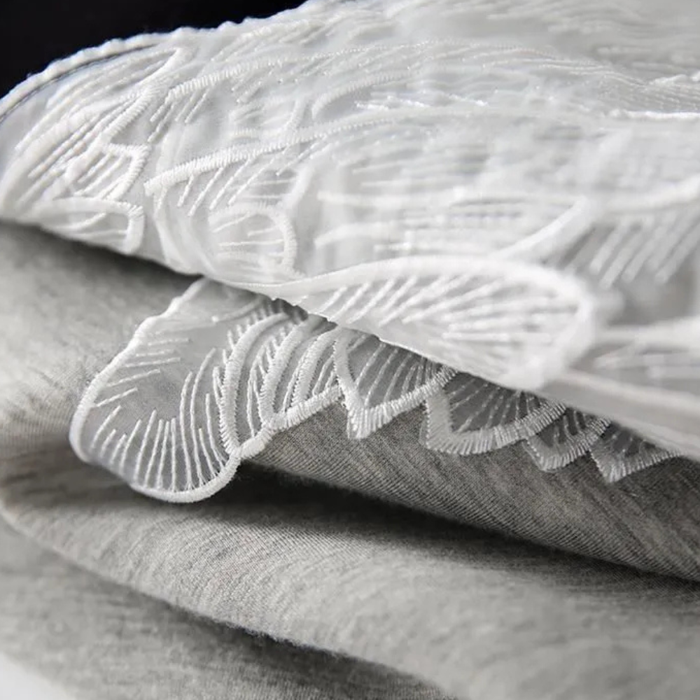 Zwarte luxe sweatshirt - stijlvolle dames trui met vleugeldetail