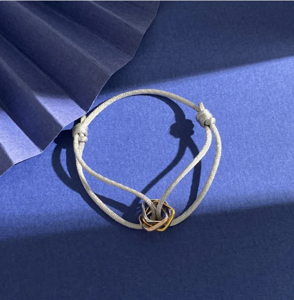 Élégance trinity armband - verfijnde damesarmband met gouden en zilveren accenten