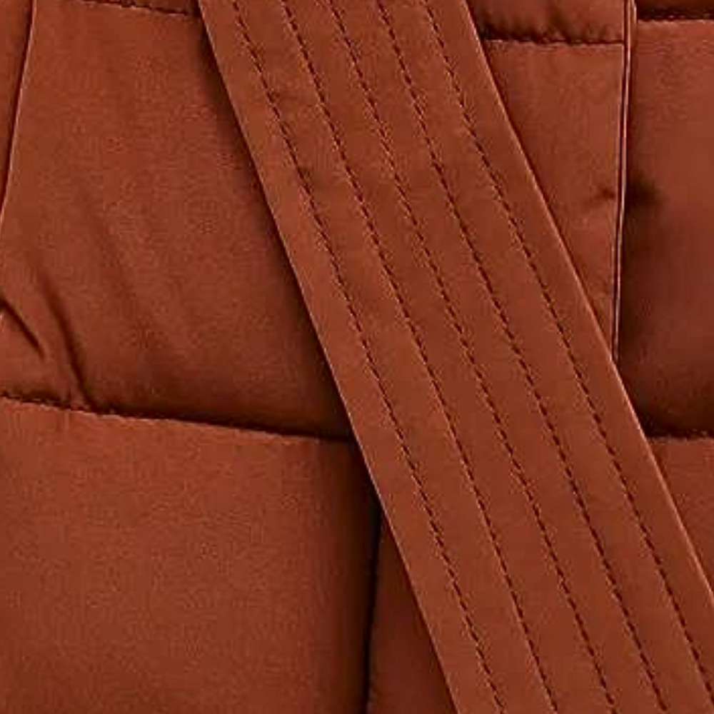 Lange gewatteerde jas - stijlvolle winteroutwear voor dames met nepbont capuchon