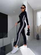 Dames sportieve jumpsuit activewear met lange mouwen en rits - strak zwart casual of workout outfit