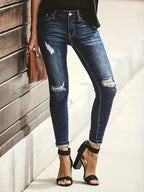 Diepblauwe distressed skinny jeans - trendy dames denimbroek