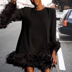 Zwarte jurk met veerafwerking - elegante cocktailoutfit voor dames