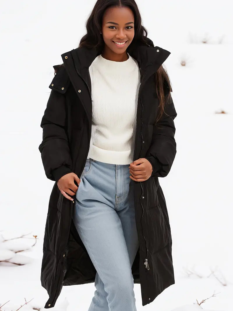 Zwarte lange winterjas met capuchon voor dames – isolerend en comfortabel - Bakkermode.nl