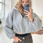 Cropped hoodie - korte sweater voor dames met ritssluiting en ballonmouwen - Bakkermode.nl
