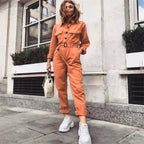 Damesoveralls - stijlvolle casual jumpsuit in oranje met lange mouwen en ceintuur