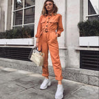 Damesoveralls - stijlvolle casual jumpsuit in oranje met lange mouwen en ceintuur