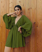 Jurk met wijde mouwen en diepe V-hals - Bakkermode.nl