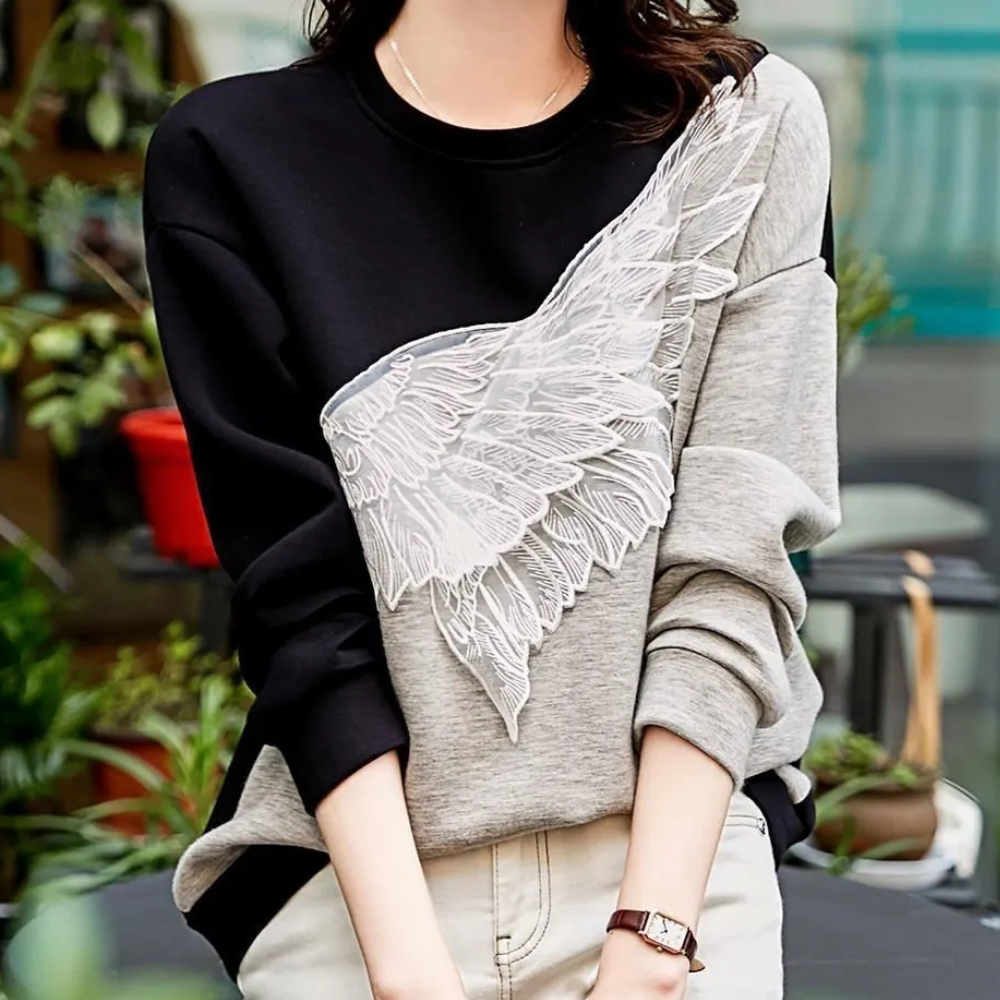 Zwarte luxe sweatshirt - stijlvolle dames trui met vleugeldetail