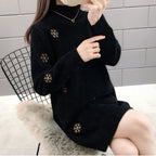 Chique gebreide sweaterjurk met lange mouwen en geborduurde details