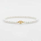 Parelarmband - elegante witte damesarmband met hartjesbedel