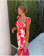 Dames midi-jurk met bloemenprint en rimpels in roze en oranje - elegante avondoutfit