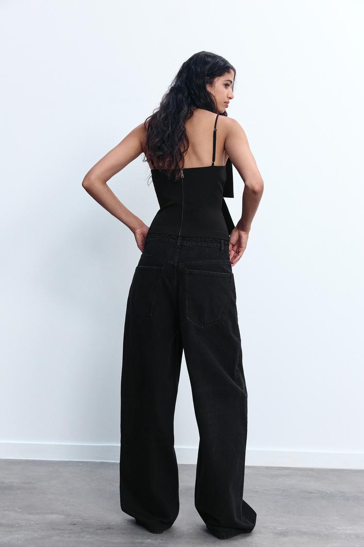 Dames tops met elegante strikdetails - zwarte glitter blouse voor avondsfeestjes