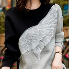 Zwarte luxe sweatshirt - stijlvolle dames trui met vleugeldetail