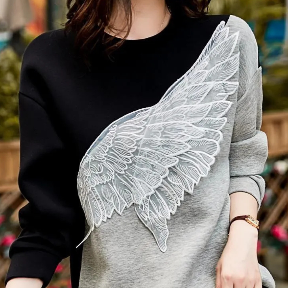 Zwarte luxe sweatshirt - stijlvolle dames trui met vleugeldetail