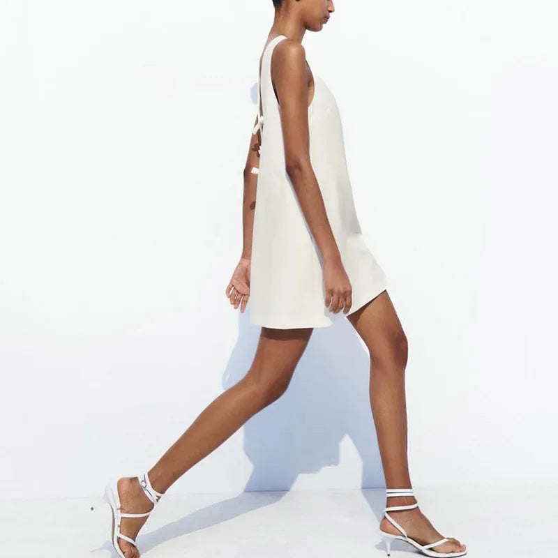 Jurk met open rug en strikdetails - Bakkermode.nl