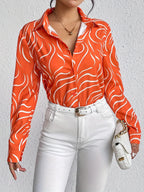 Oranje blouse met abstracte print - Bakkermode.nl