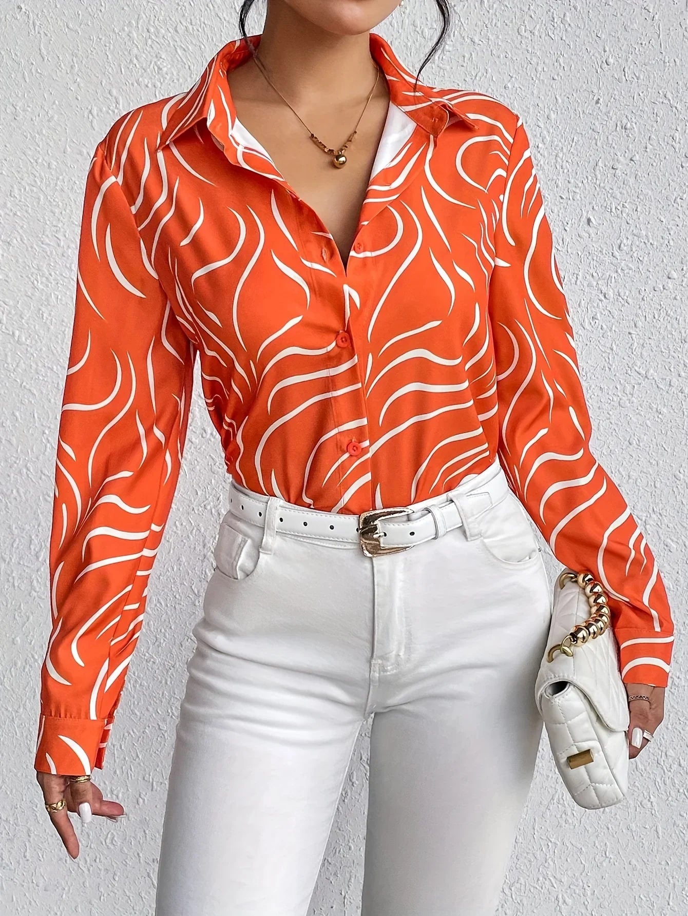 Oranje blouse met abstracte print - Bakkermode.nl