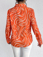 Oranje blouse met abstracte print - Bakkermode.nl
