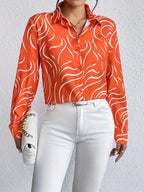Oranje blouse met abstracte print - Bakkermode.nl