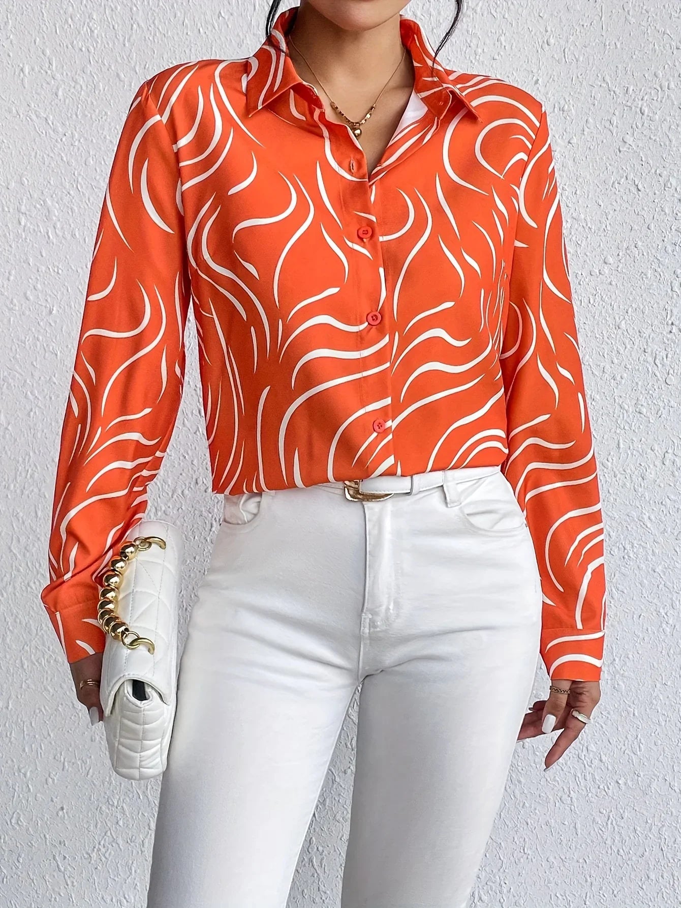 Oranje blouse met abstracte print - Bakkermode.nl