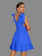 Mini-jurk met diepe V-hals en strikbanden - Bakkermode.nl