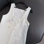 Jurk met open rug en strikdetails - Bakkermode.nl