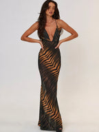 Verleidelijke maxi-jurk met tijgerprint en diepe halslijn - Bakkermode.nl