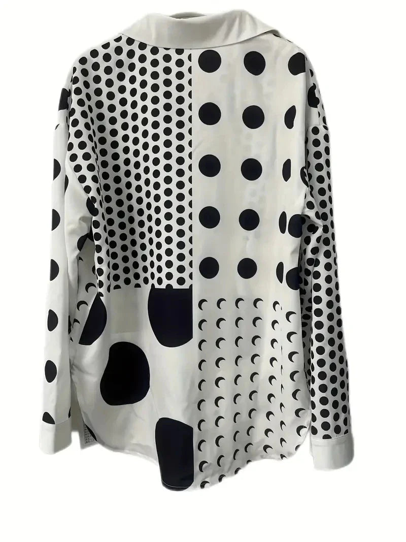 Zwart-witte blouse met stippen en geometrische patronen - Bakkermode.nl