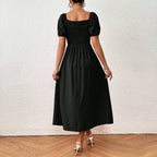 Elegante zwarte jurk met pofmouwen - Bakkermode.nl