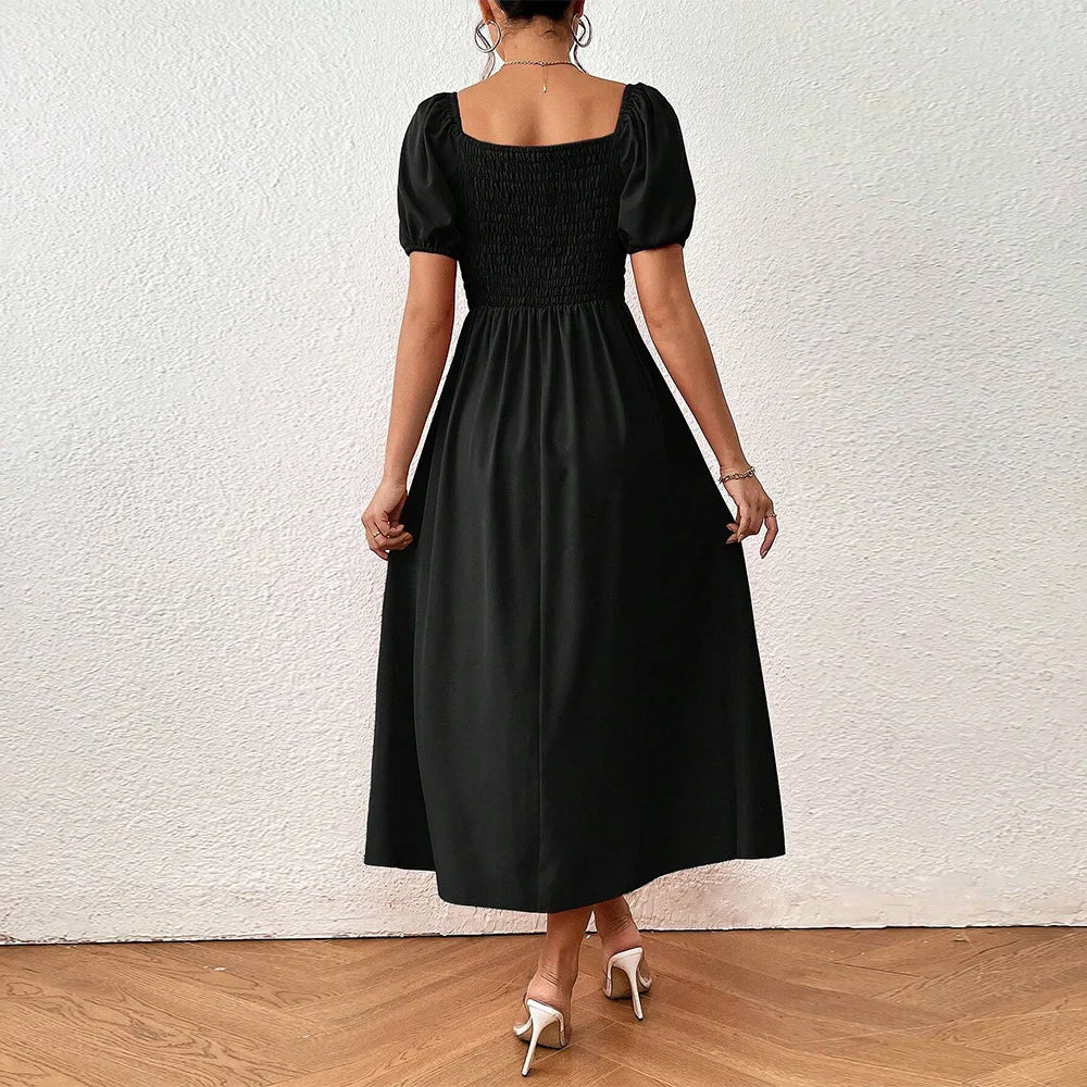 Elegante zwarte jurk met pofmouwen - Bakkermode.nl