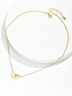 Dames dubbele hart ketting - verfijnd ontwerp met in elkaar verweven harten in vergulding