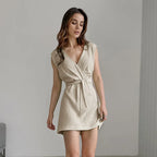 Stijlvolle zomerjurk met wikkeldetail - Bakkermode.nl