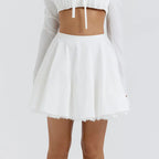 Uitlopende high-waist mini rok - Bakkermode.nl