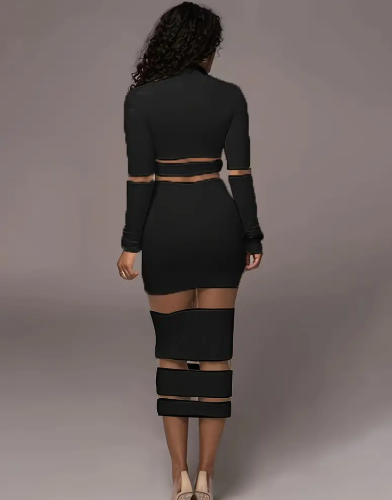 Verleidelijke zwarte jurk met doorschijnende details - Bakkermode.nl