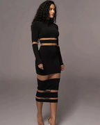 Verleidelijke zwarte jurk met doorschijnende details - Bakkermode.nl