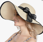 Brede rand zonnehoed met strikdecor voor op het strand - Bakkermode.nl