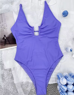 Paars badpak met diepe hals en open rug - Bakkermode.nl