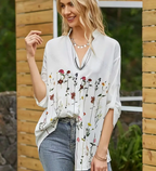 Witte blouse met bloemenprint - Bakkermode.nl
