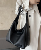 Zwarte schoudertas van imitatieleer - Bakkermode.nl