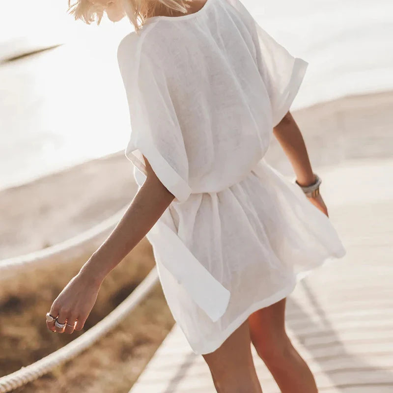 Jurk met V-hals en wijde mouwen - Bakkermode.nl