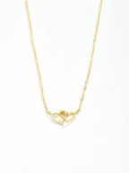 Dames dubbele hart ketting - verfijnd ontwerp met in elkaar verweven harten in vergulding