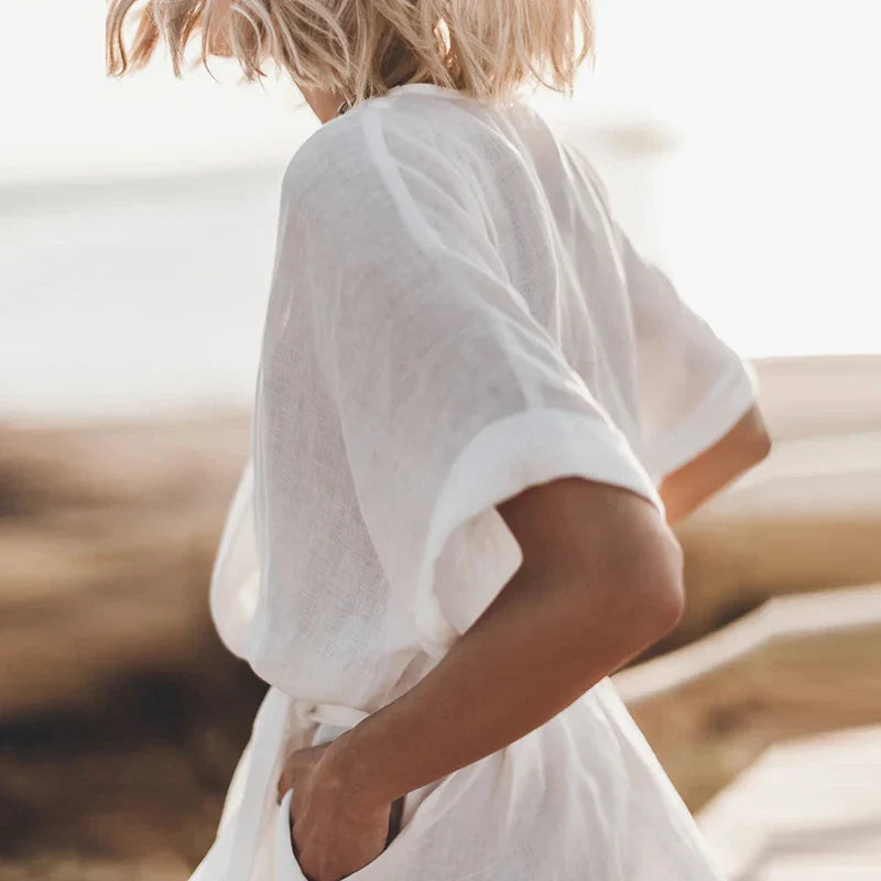 Jurk met V-hals en wijde mouwen - Bakkermode.nl