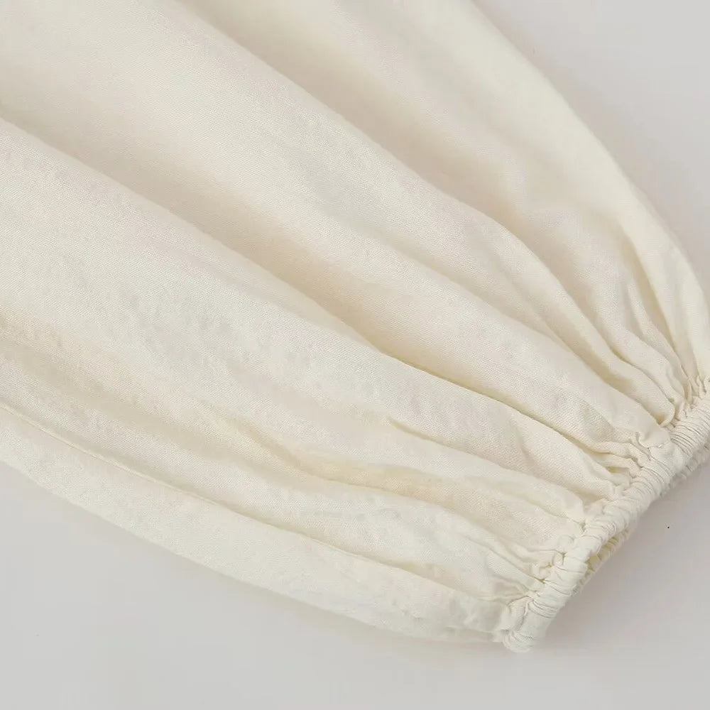 Jurk met borduurwerk en lange mouwen - Bakkermode.nl