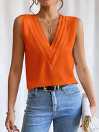 Mouwloze blouse - verfijnde dames top met geplooide details