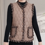 Gequiltte vest - stijlvolle gewatteerde damesgilet met pomponrand