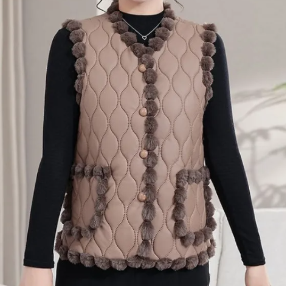 Gequiltte vest - stijlvolle gewatteerde damesgilet met pomponrand