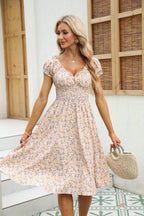 Vrouwelijke bloemen midi jurk - luchtige smock jurk voor zomerse gelegenheden