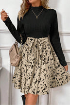 Zwarte a-lijn jurk met dierenprint rok - elegante damesensemble