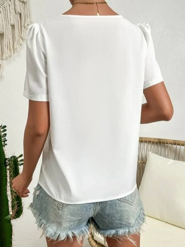 Dames asimmetrische korte mouwen top - trendy witte pofmouwen voor smart casual look