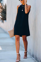 Zwarte mini-jurk met geschulpte halslijn - Bakkermode.nl